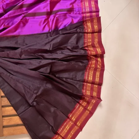 Vibrant orchid magenta Narayanpet handloom silk saree with deep charcoal and gold zari temple border