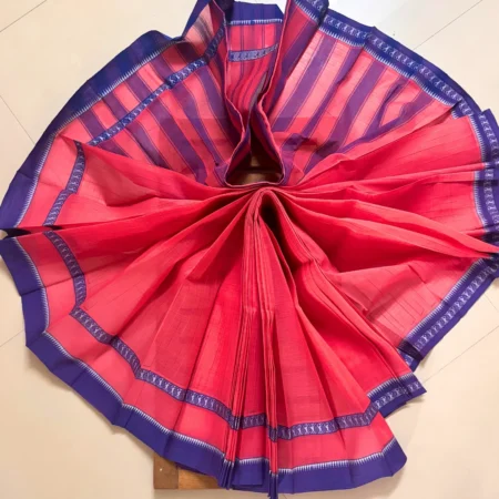 Fuchsia pink Narayanpet handloom cotton saree with royal blue temple weave border, folded